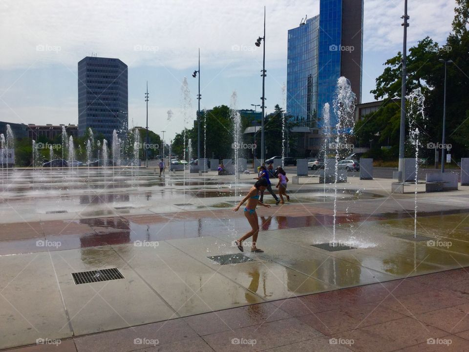 Girl playing at United Nation. Girl playing fountains at United Nation front square