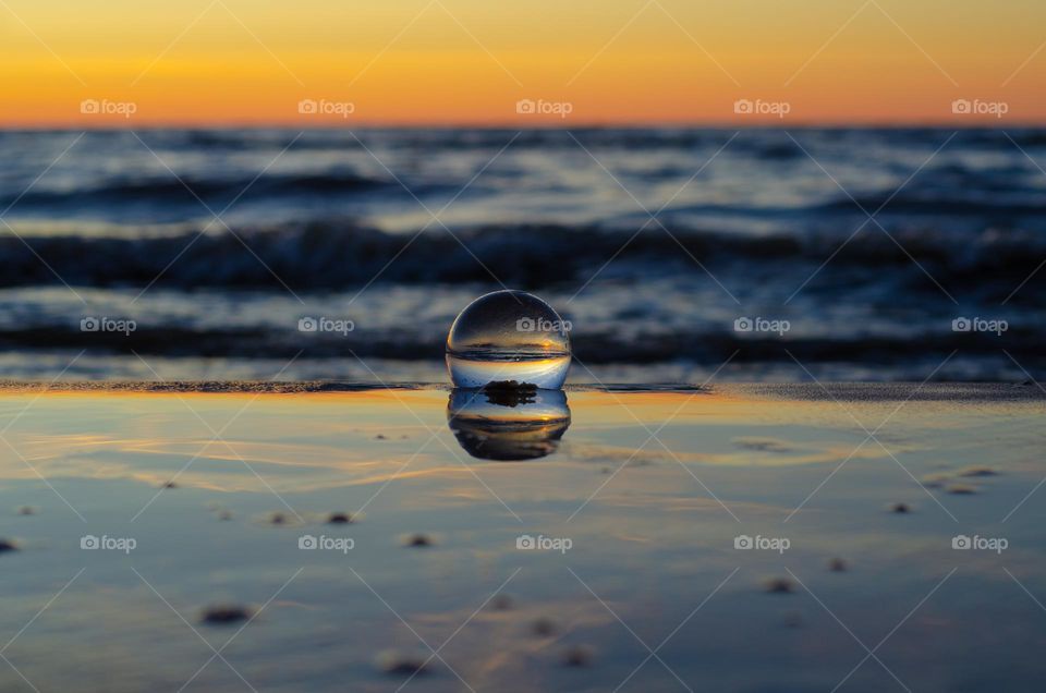 Beautiful and georges Baltic sea sunset through the lensball