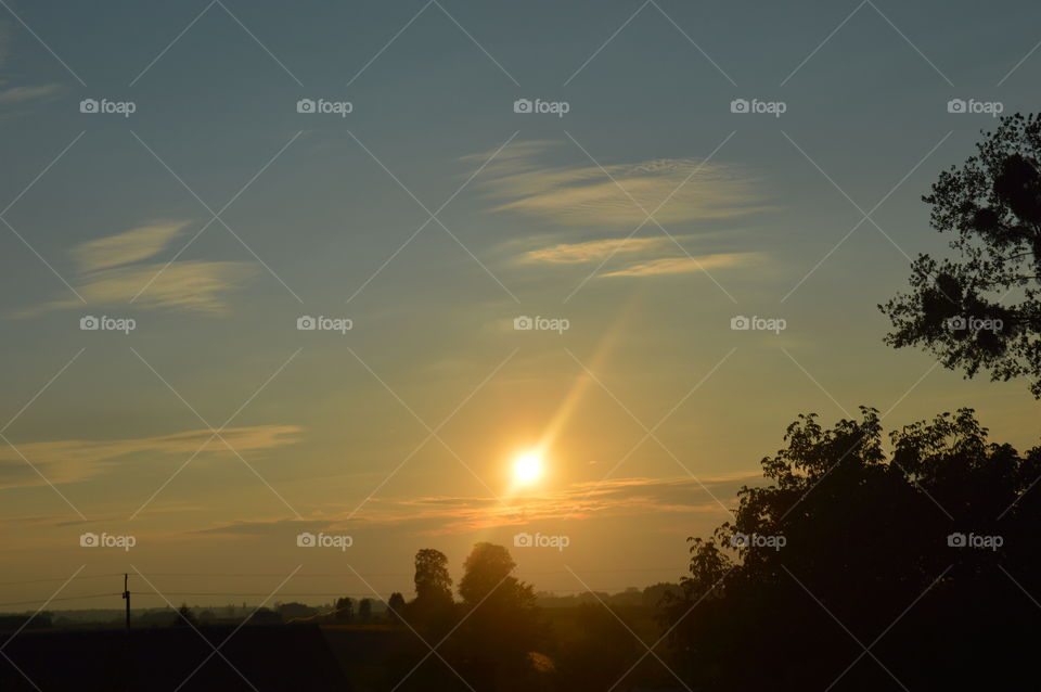 Warm illuminating sun rays before sunset