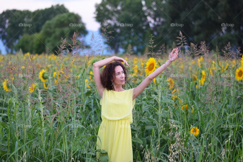 Beautiful Young Woman Dancing Outside in Nature