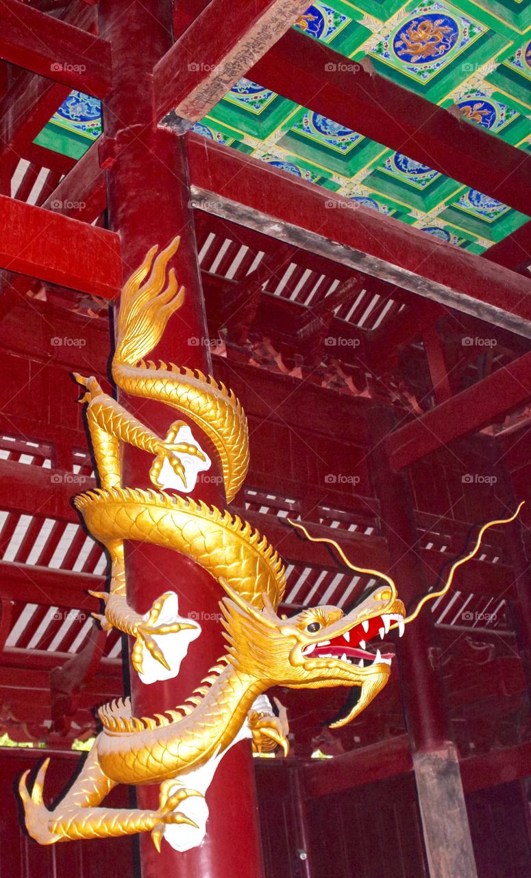 Golden dragon on the red pole