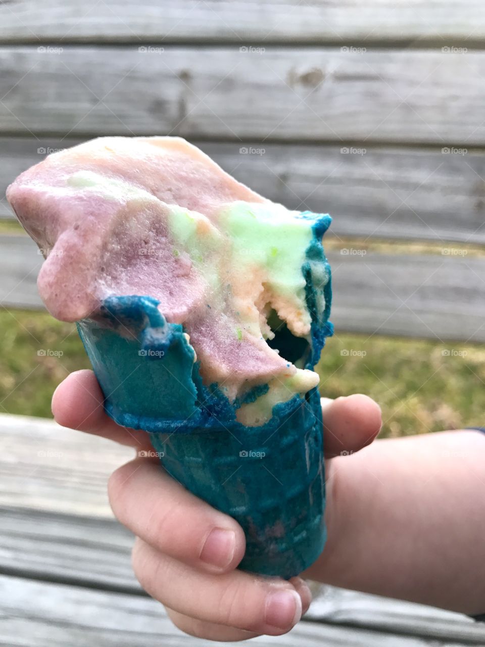 Child's hand with ice cream cone
