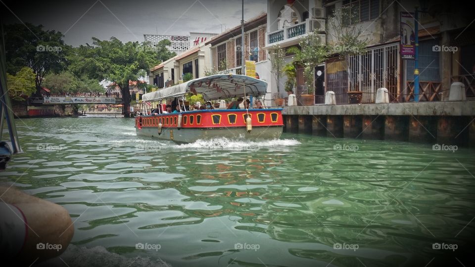 Cruising on the water to see what's the city has to offer.  

Malacca, Malaysia