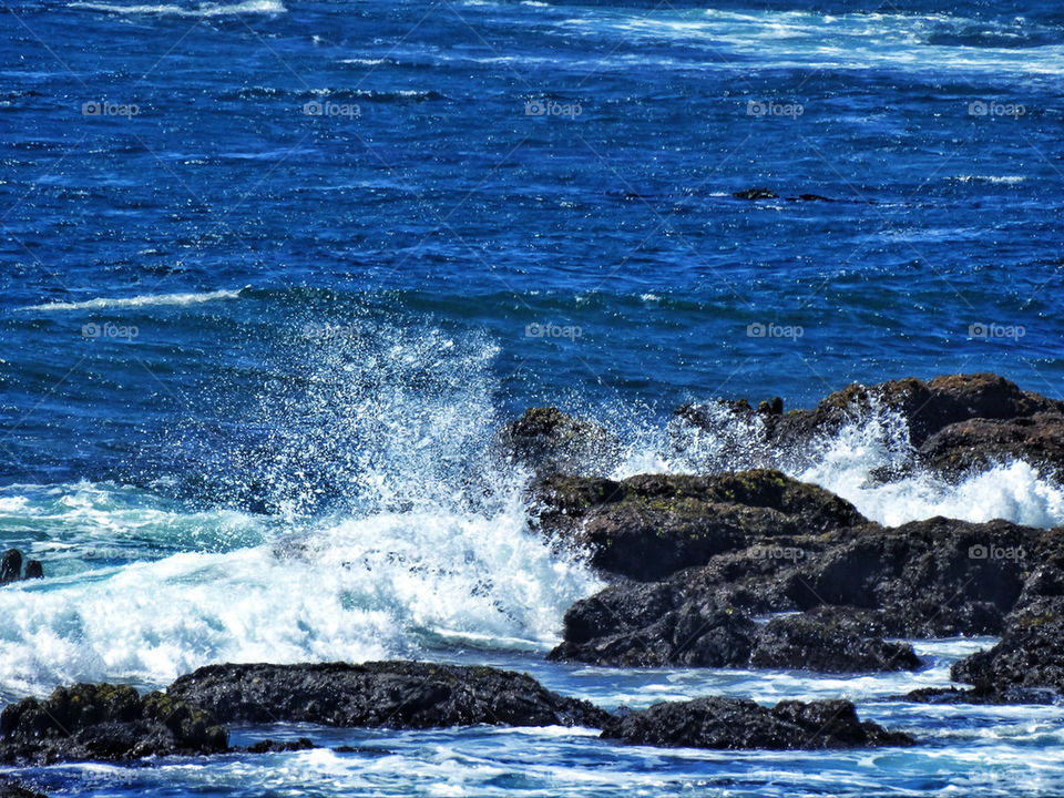 Ocean waves crashing over rocks