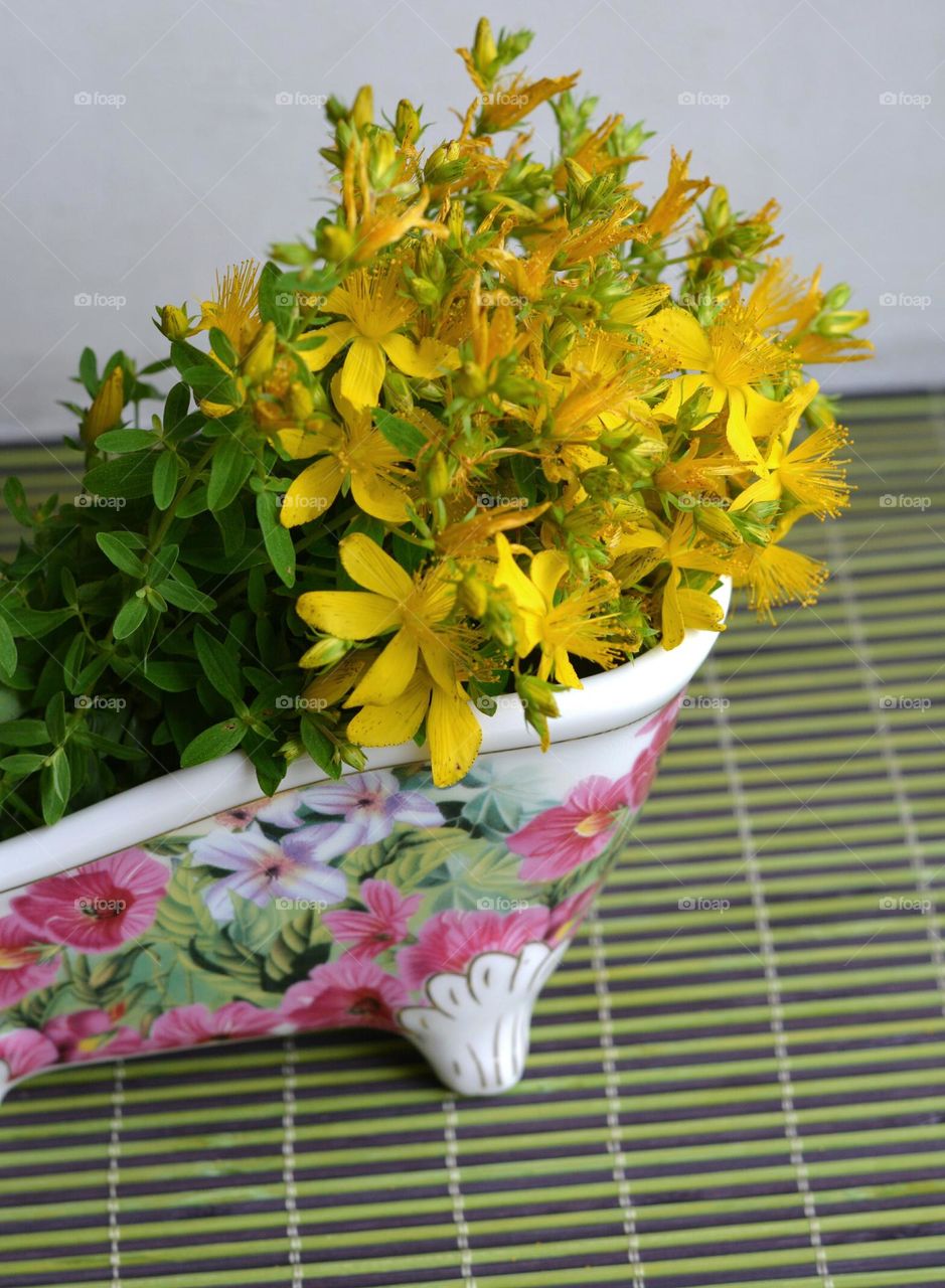 yellow flowers in vase summer time