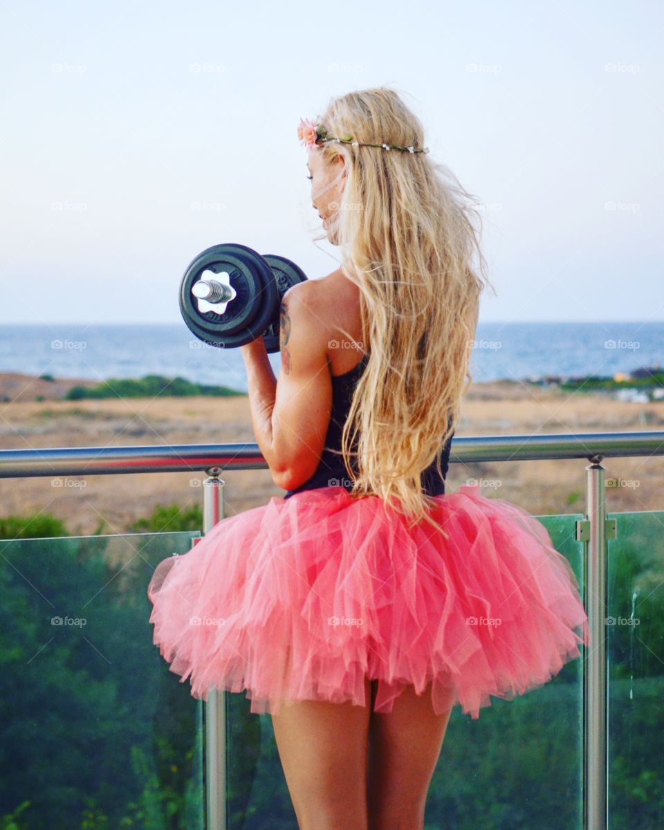 Girl with dumbbell 

