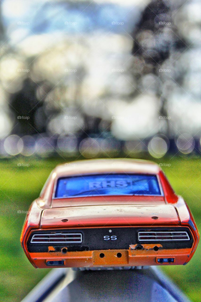 a broken toy car with no wheels