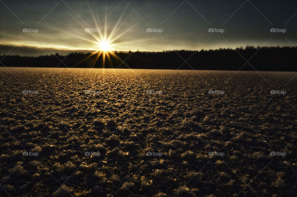 sunrise on the lake in winter
