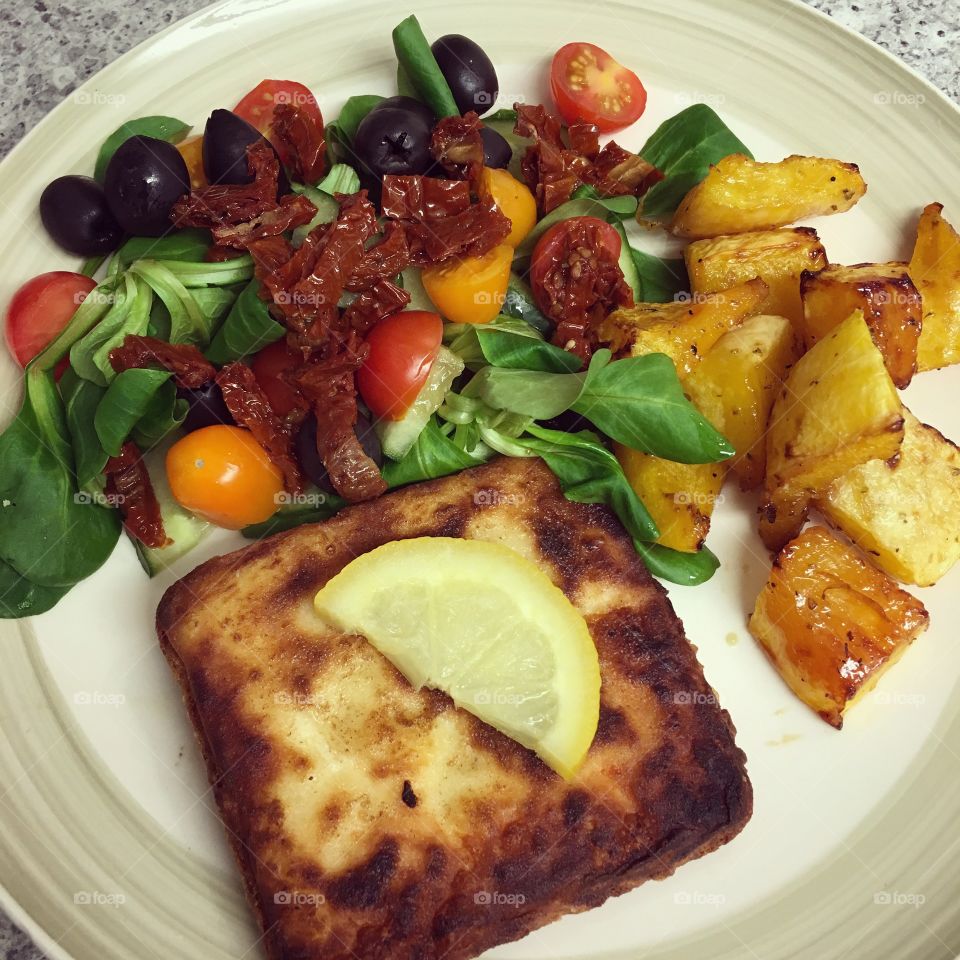 Greek saganaki cheese with butternut squash and salad