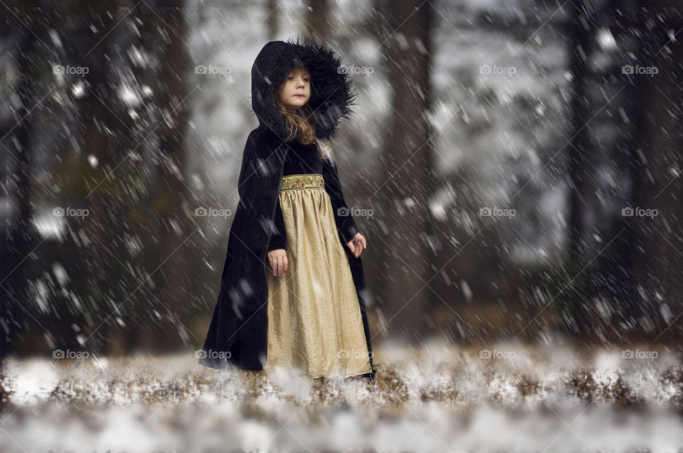 Cute little girl in snowy weather