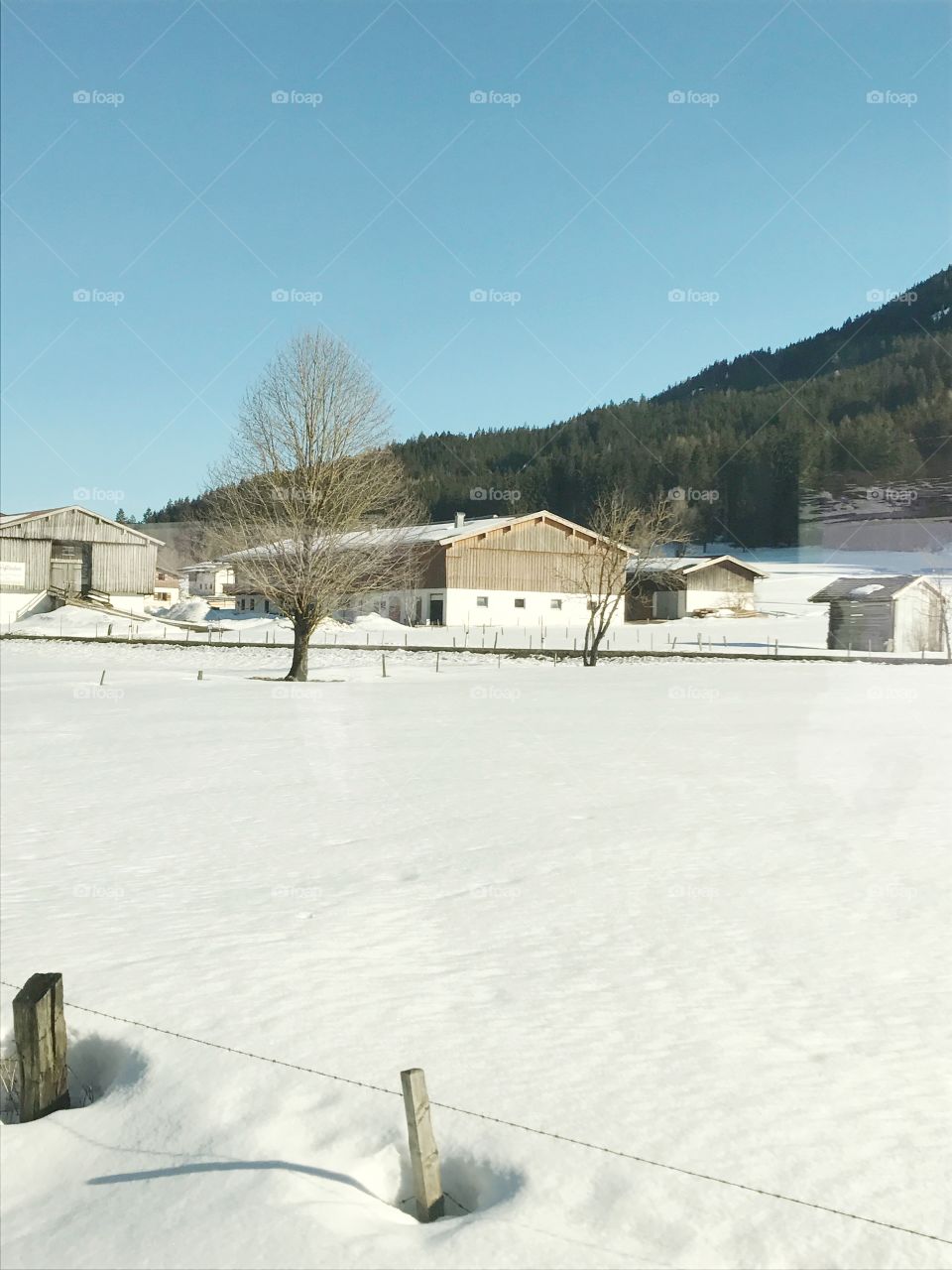 Wooden houses in snow in Austria 