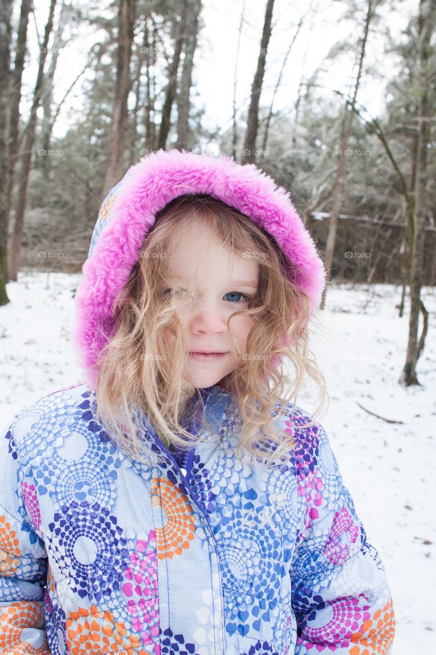 Girl in snowy woods