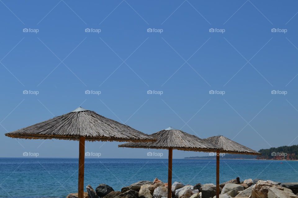 Beach umbrellas against the background of the sea