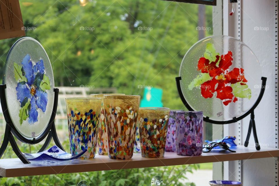 Colorful Glassware on display in a window at a gift shop while on vacation in Vermont.