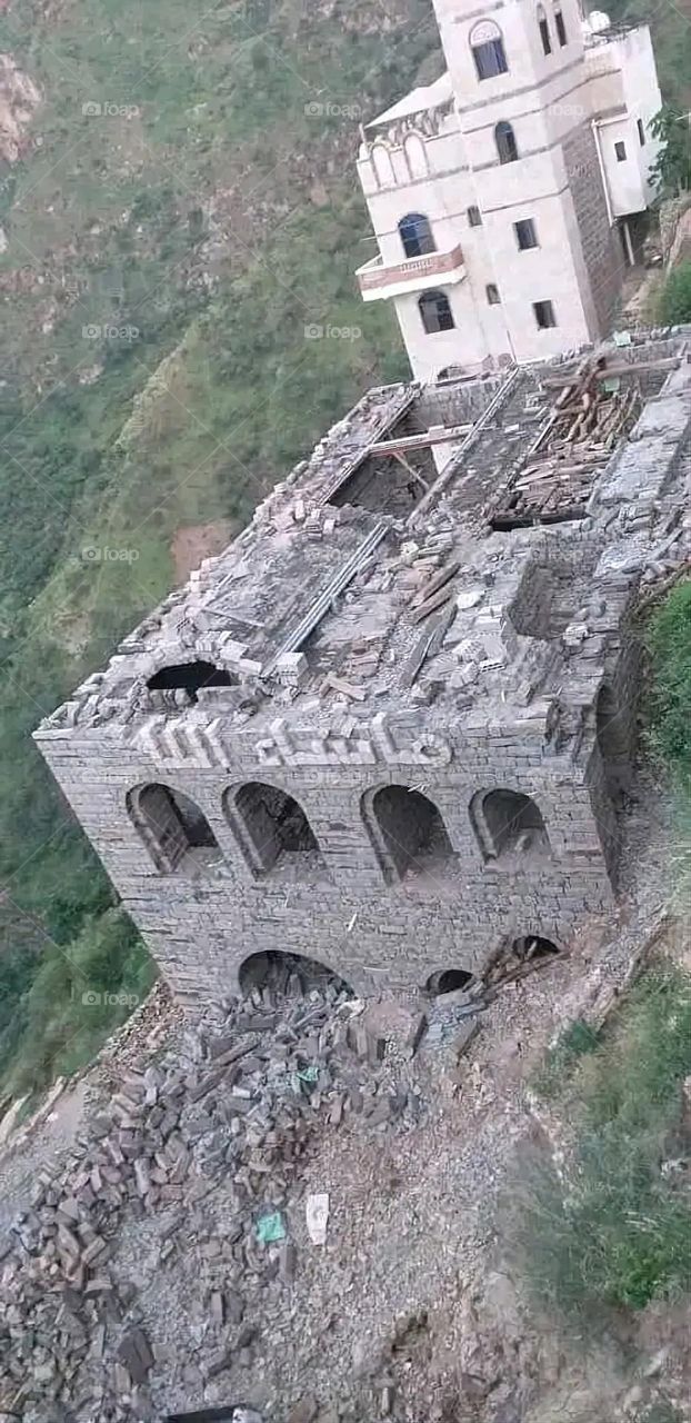 A stunning view of green mountains covered in fog in Yemen