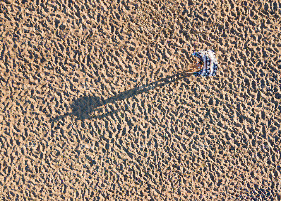 Person shades the ground 