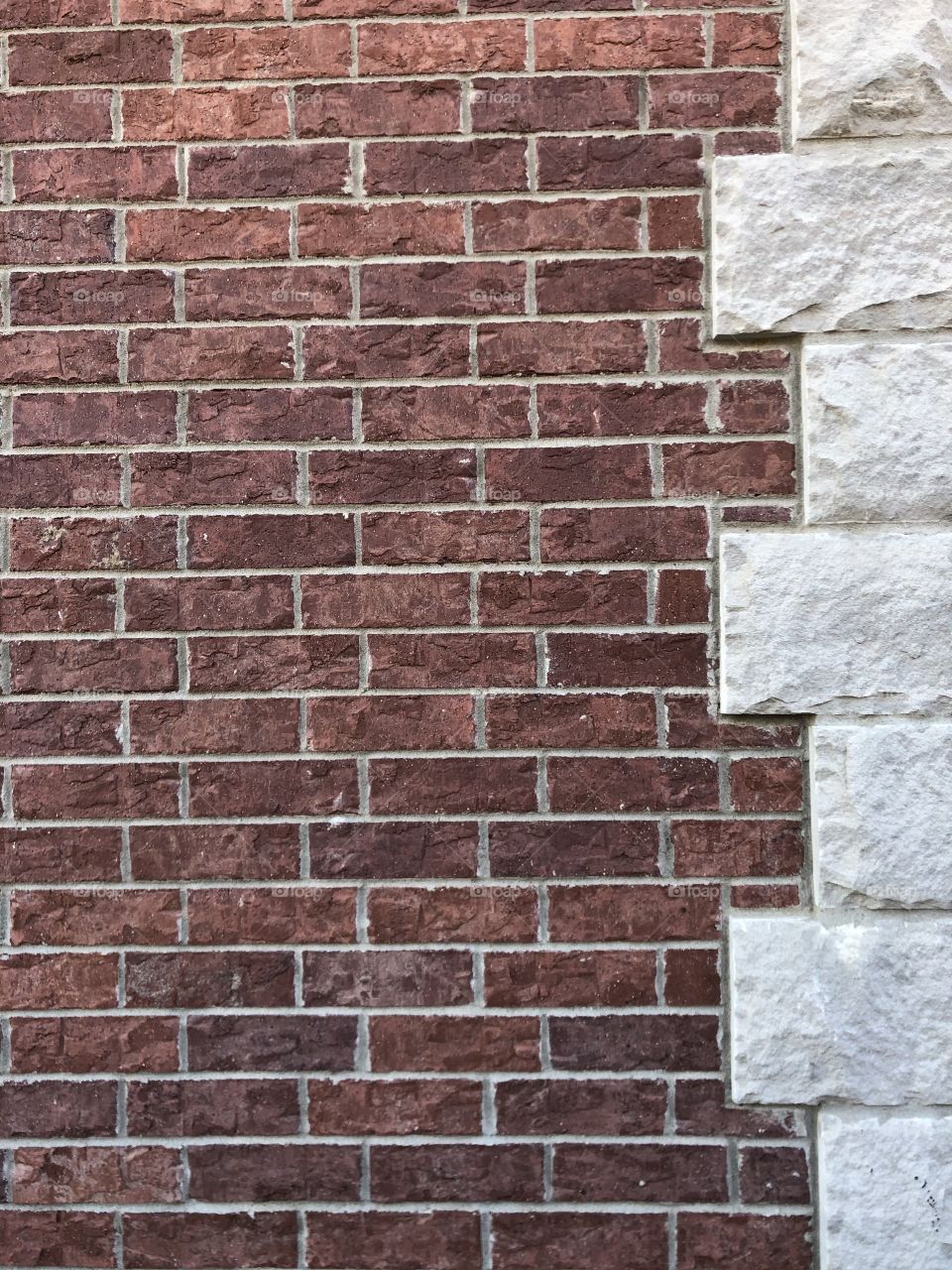 Sturdy brick wall bordered with stone