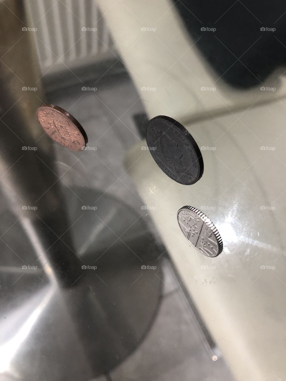 The great mind to stand the pence in the glass table.