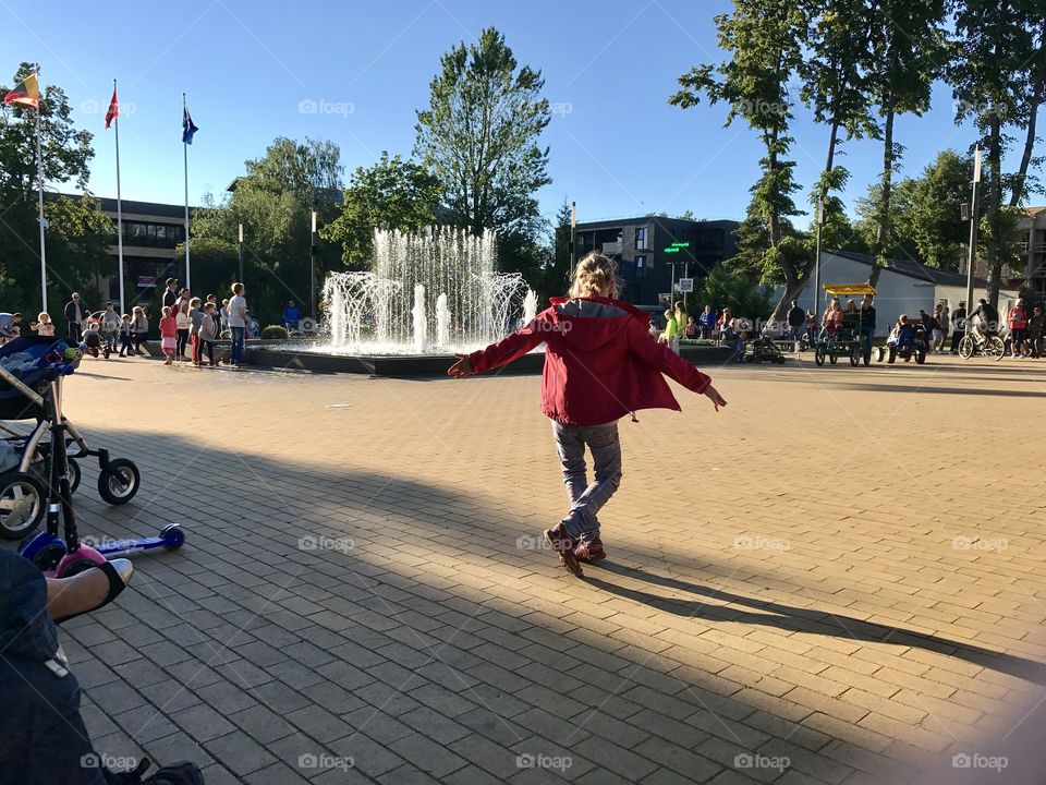 Girl dance near the fountain 
