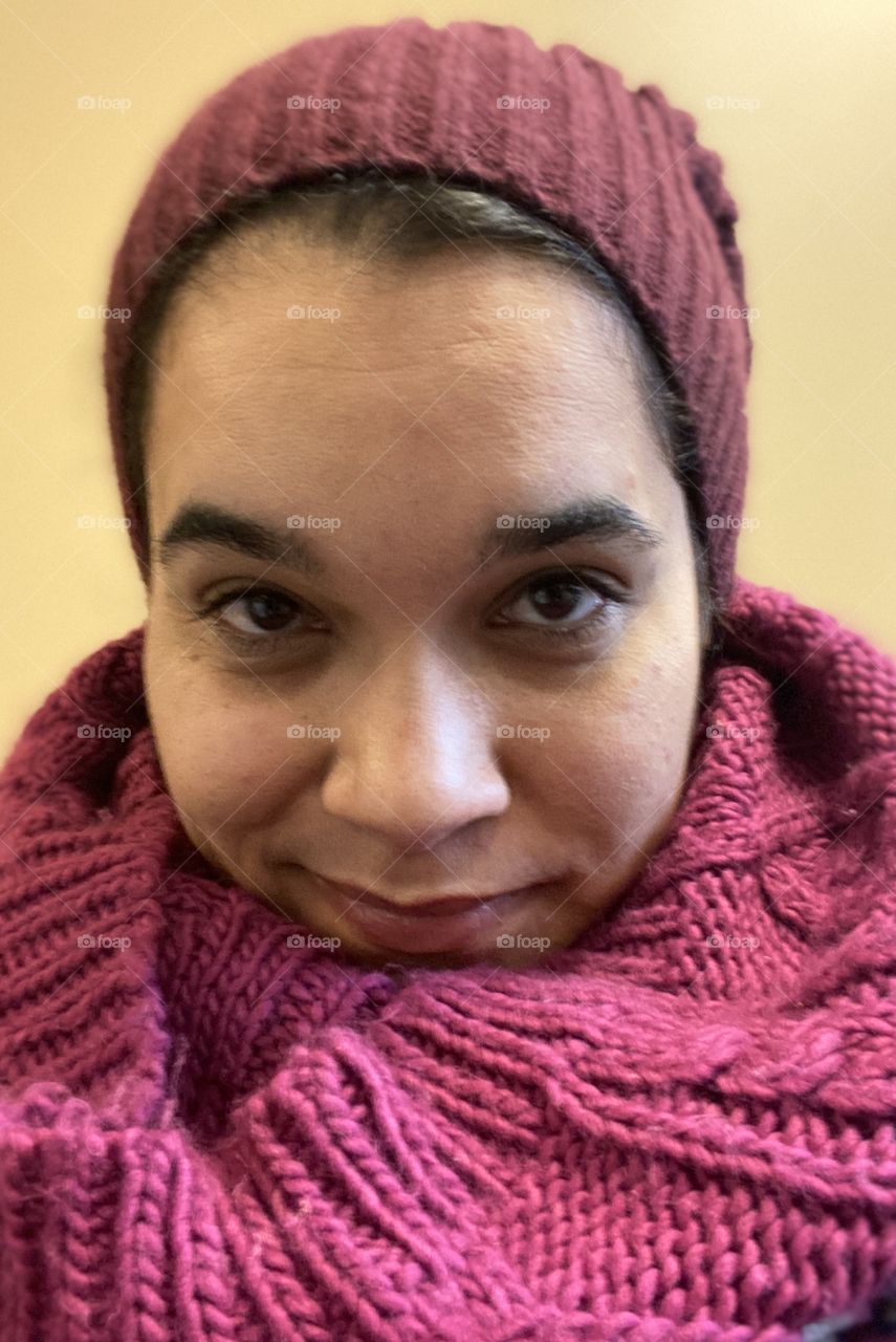 Woman with hat and scar close up selfie