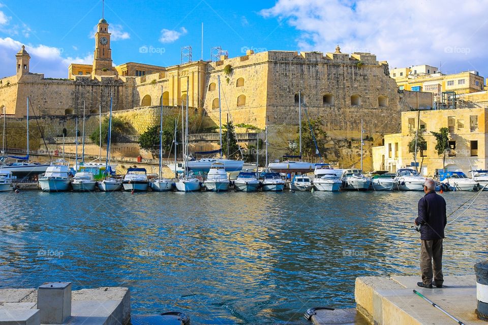 Watching the time go by in the ancient port of Valletta, Malta