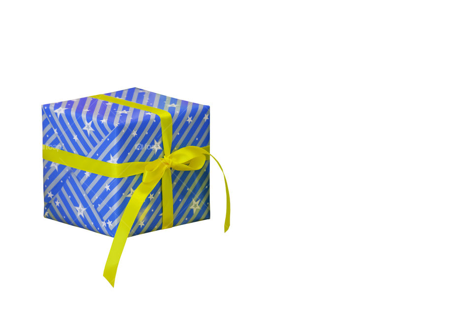 Isolated Gift box wrapped with a star pattern for the festivities on a white background with clipping path.