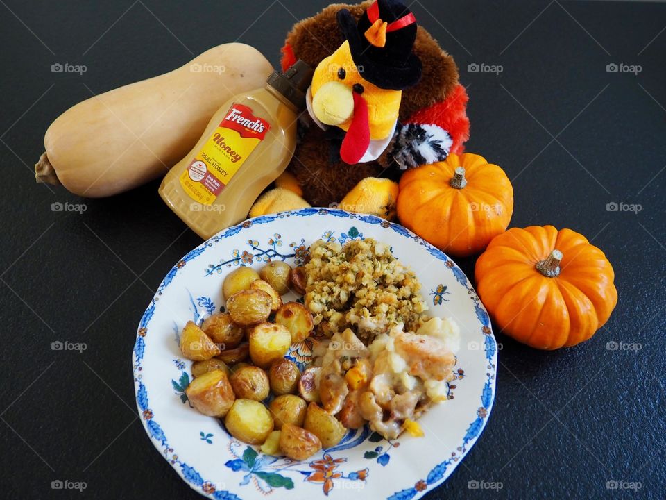 Thanksgiving plate of turkey in a creamy French’s honey mustard sauce with stuffing and roasted potatoes.