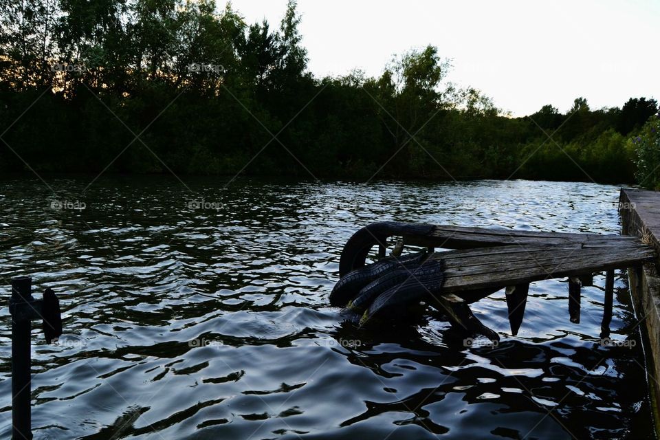 A photograph taken at a lake which is situated amongst the ruins of an old abandoned English theme park. This has since been destroyed and is now being developed.