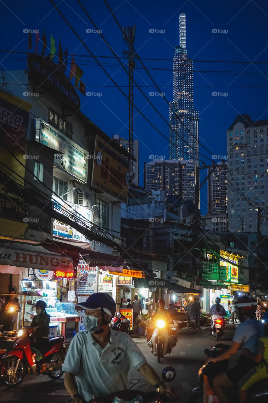 Night view of Landmark 81 from the alleys of Ho Chi Minh City, Vietnam 