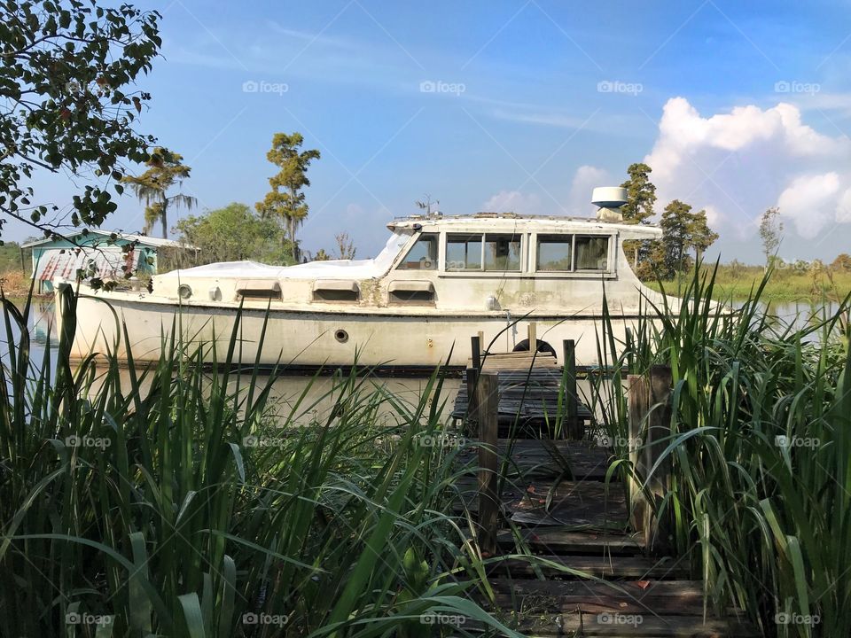 Old boat left to rot in swamp. 