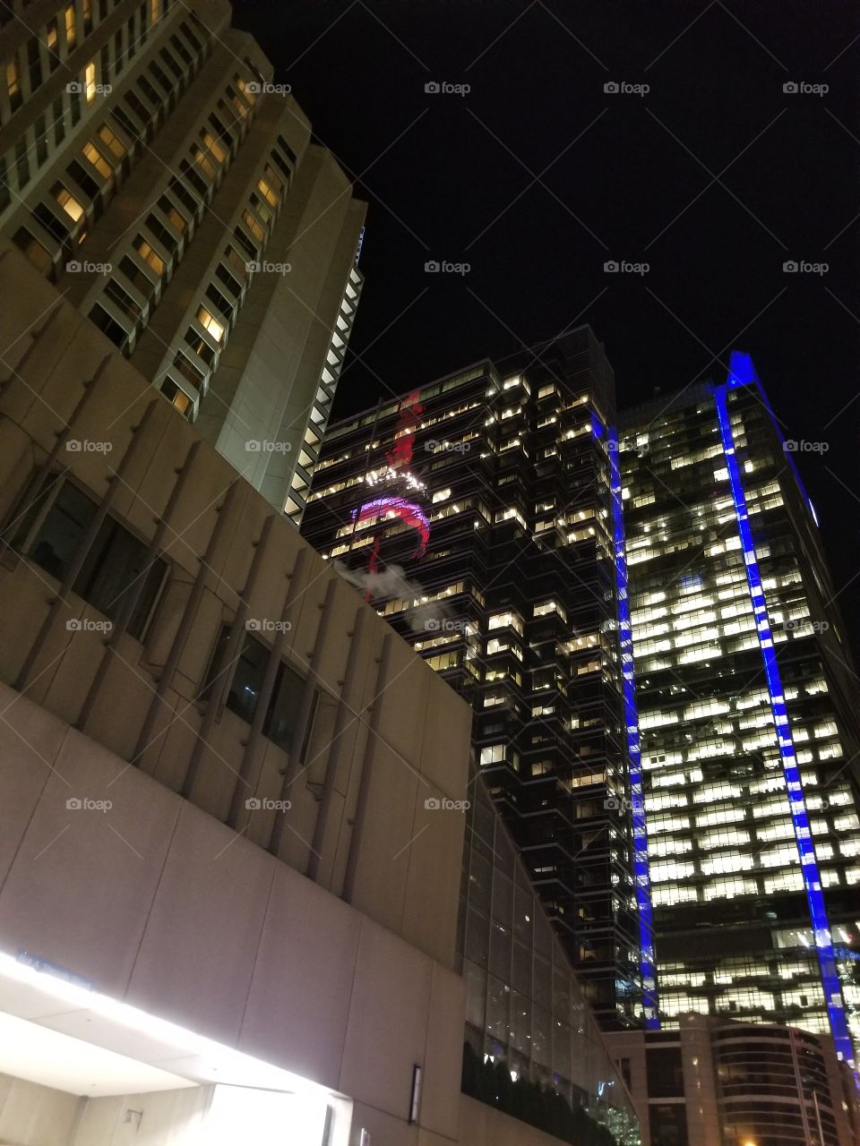 CN tower reflection on building Toronto