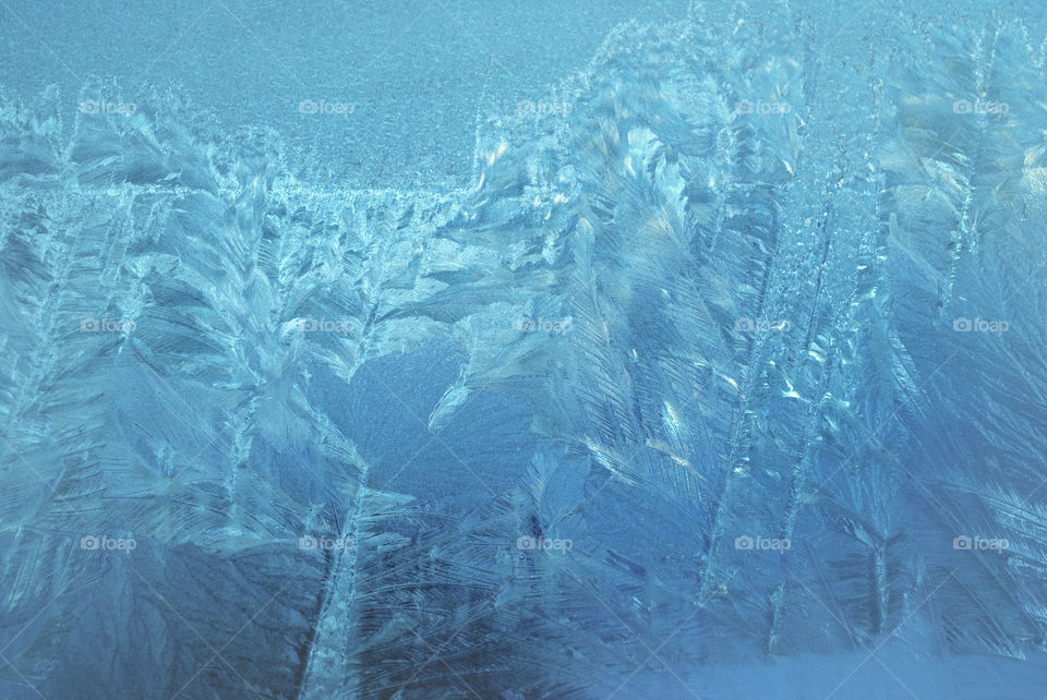 Frozen water with blue background