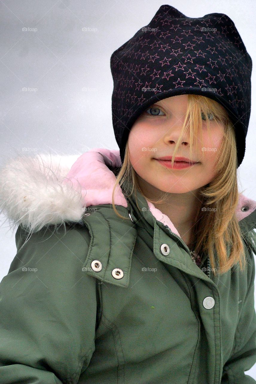 Portrait of girl with warm clothing