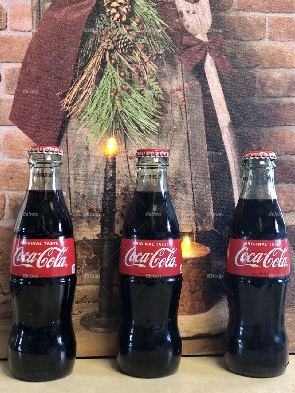 Three Coca Cola Bottles
