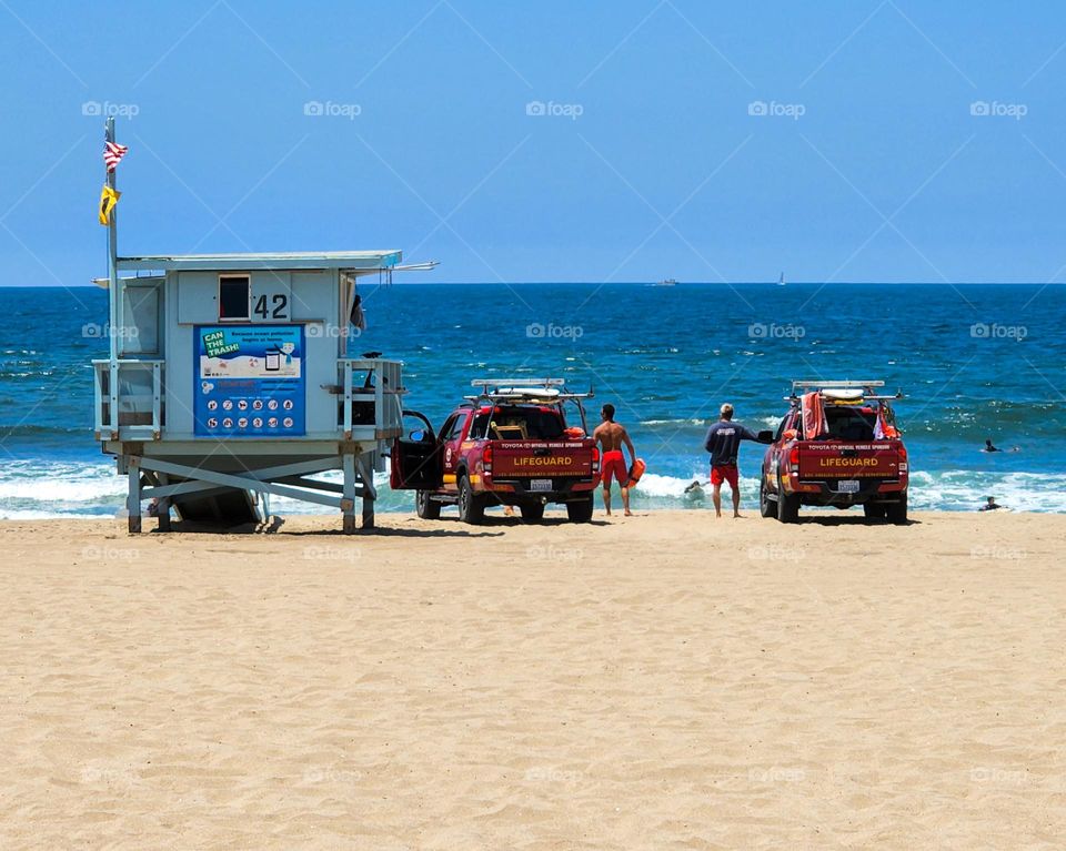Lifeguards work a beach during a national holiday weekend