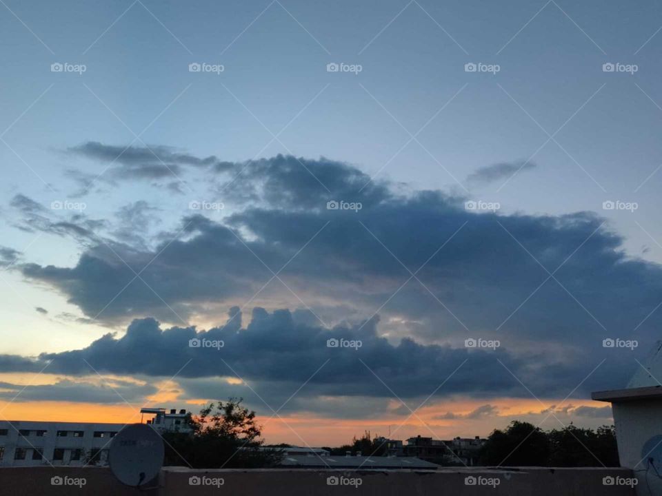 A small cloud is racing with big cloud