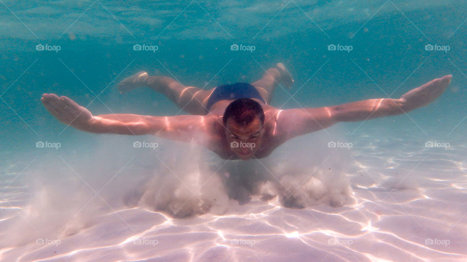 Man underwater relaxing