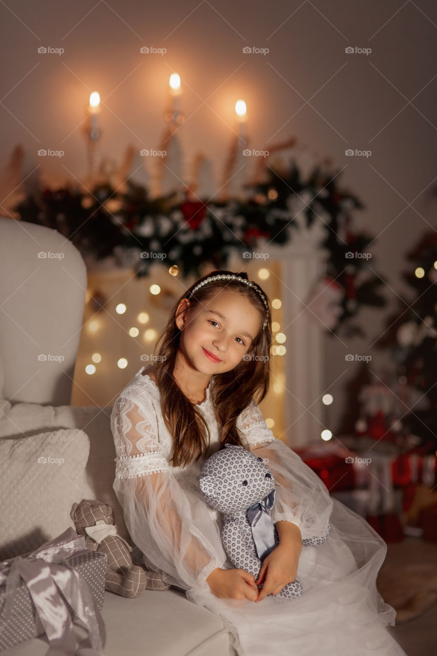 Girl in white dress at Christmas Eve 