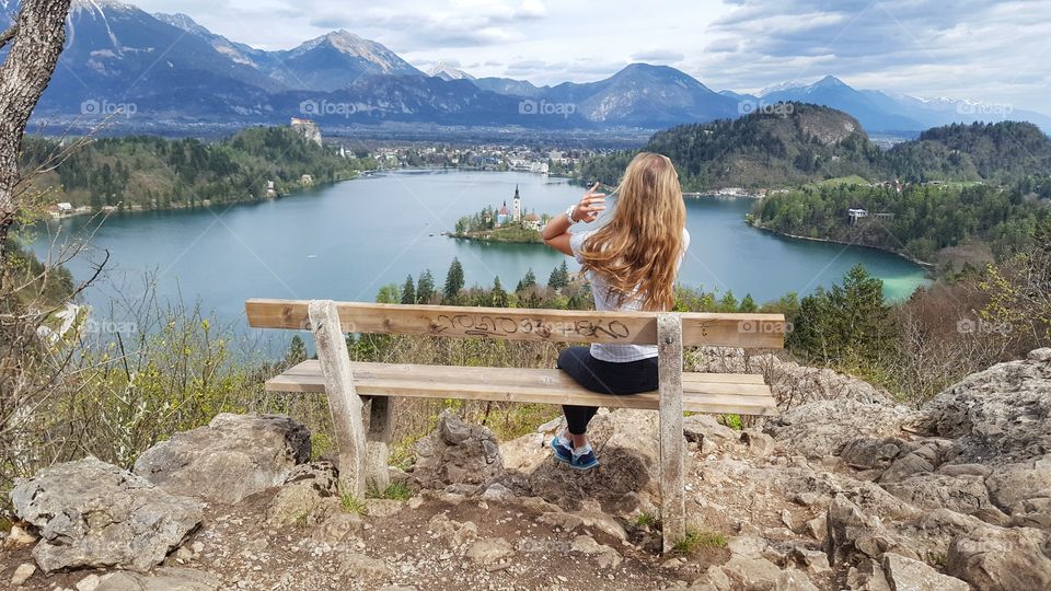 A girl enjoying the lake view