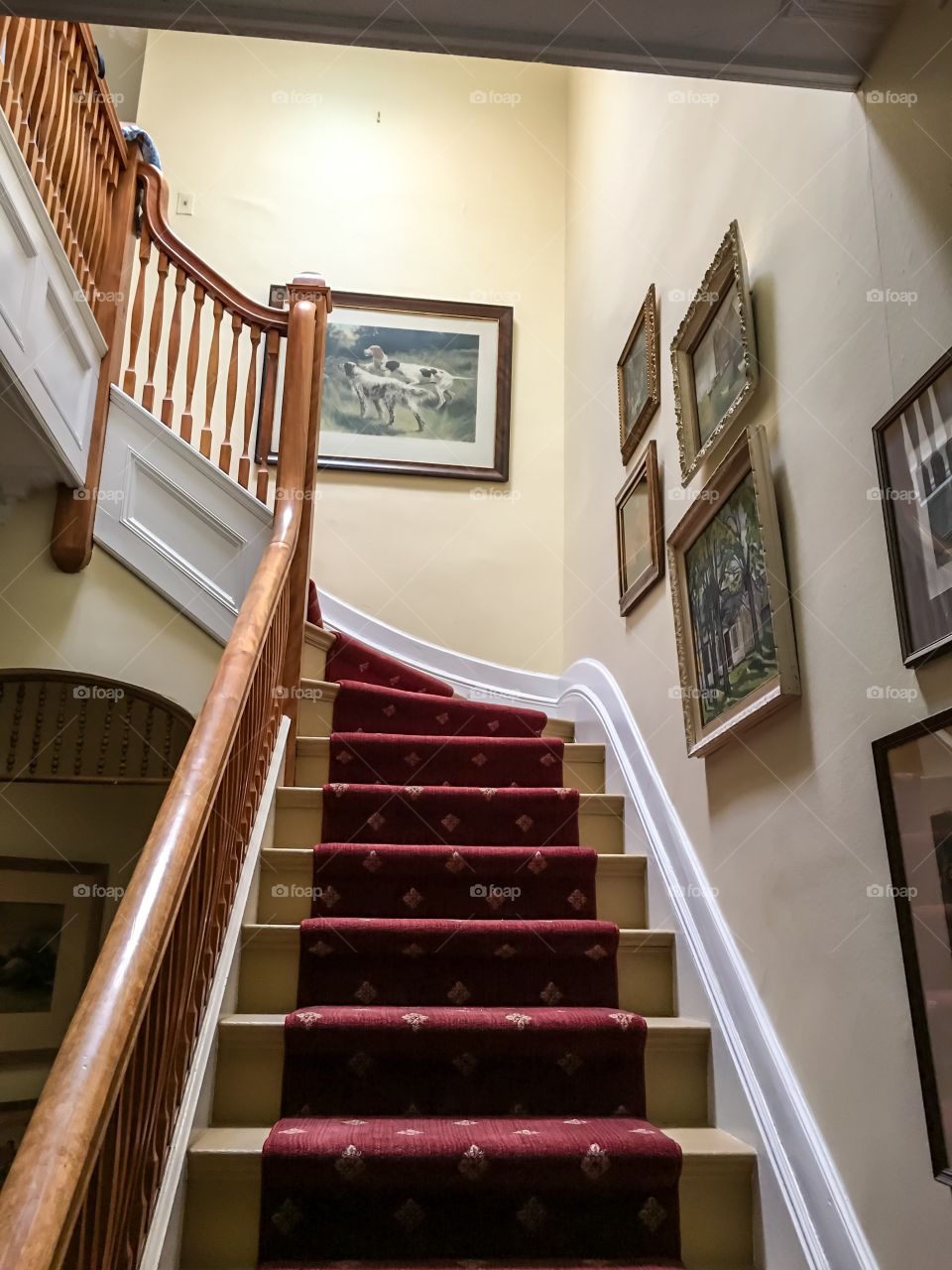 Victorian home interior staircase wood and art