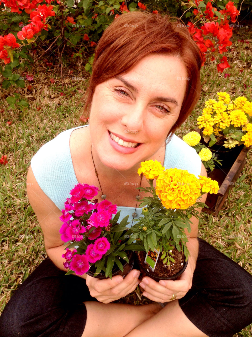 Woman with flowers in garden