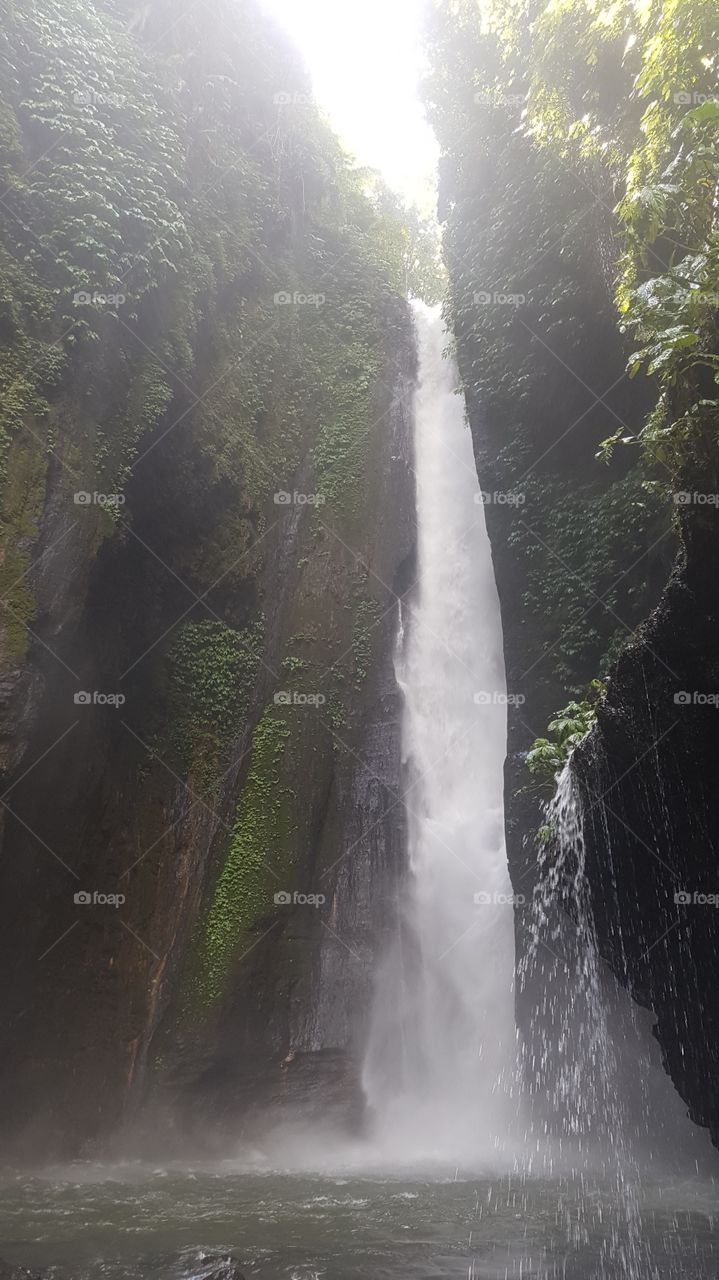 waterfalls in bali show the power of mother nature, dropping tons of water every second