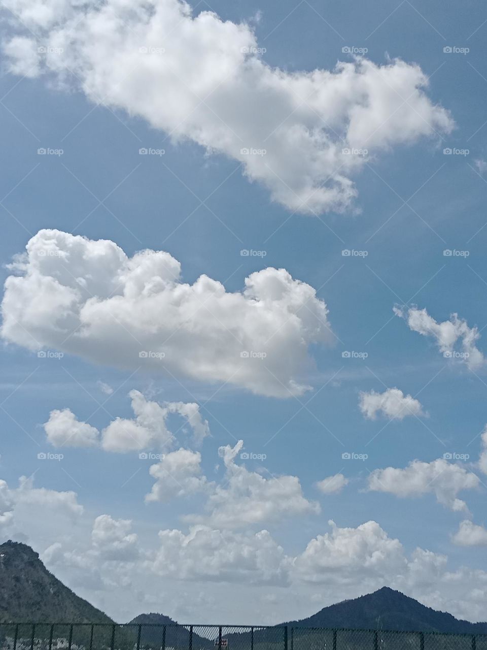 *Ravarma*  Pure White,  blue Sky, Clouds family , Mountain