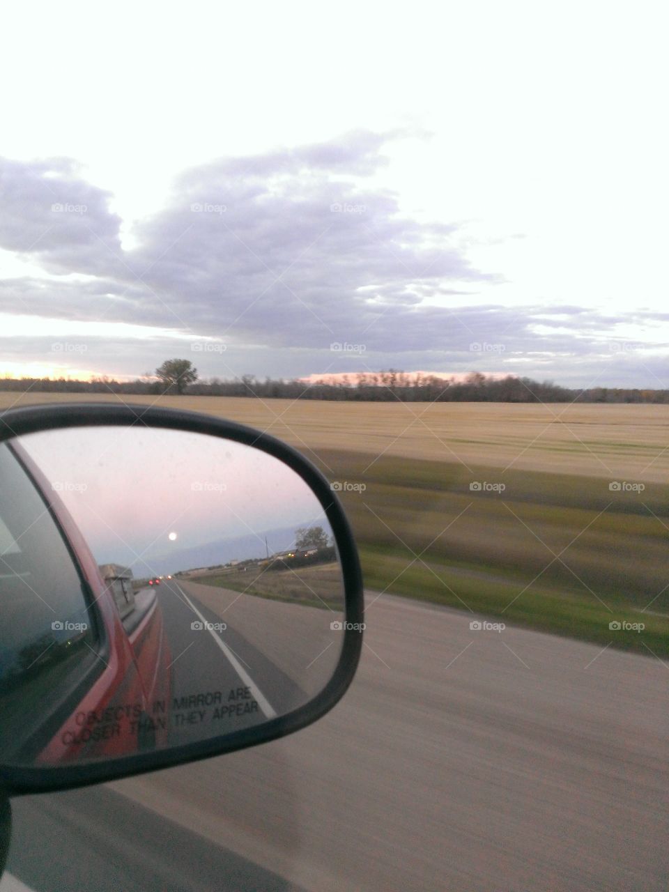 Moon in the rear view mirror 