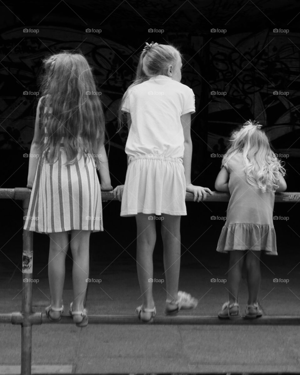 Girls watching skateboarders 