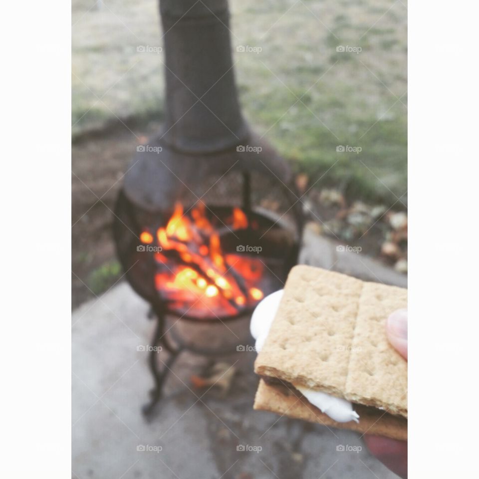 We want s'more!. Our old roommate finally got his own place with this fabulous fire pit. Late night smores with dark chocolate. Mmmm.
