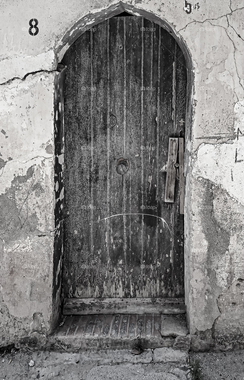 an antique door of a very ancient home