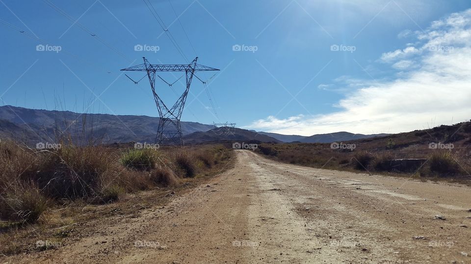 rural trail. electricity line in the mountains