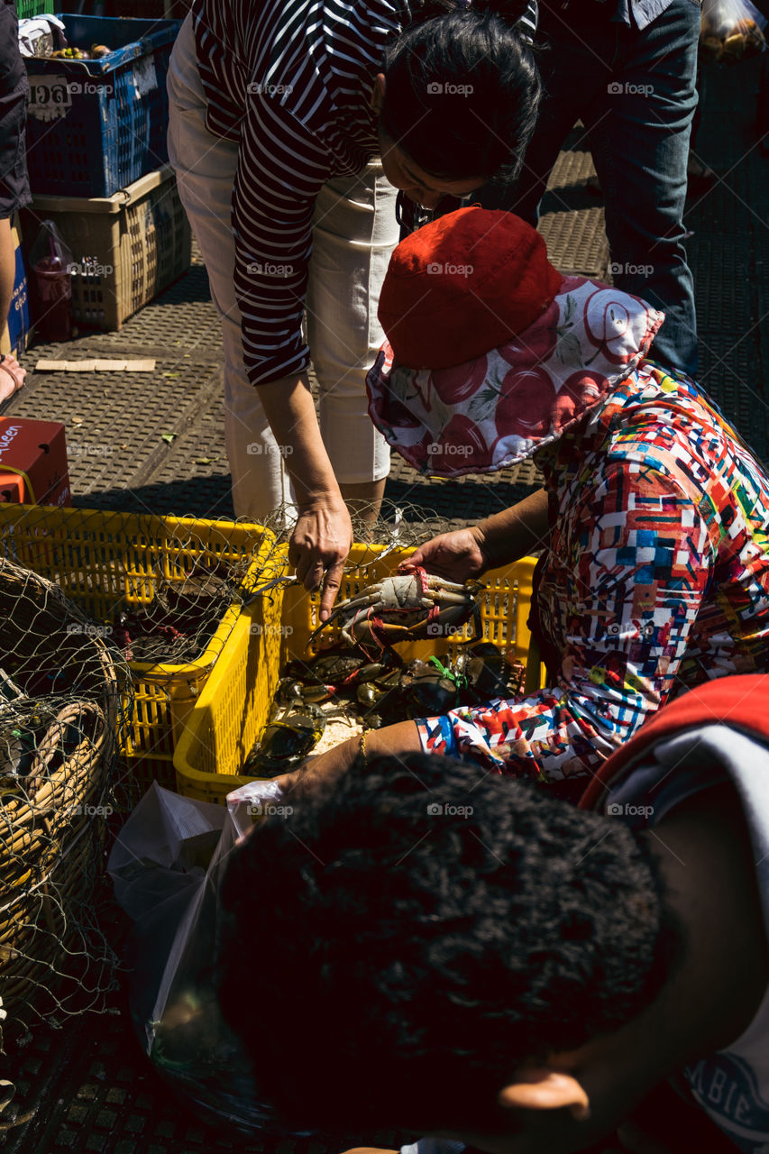 Woman selling crab at the local market