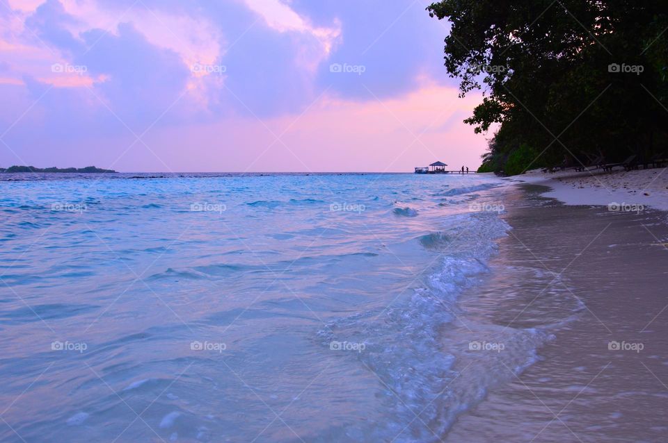 pastel pink sky in Maldives